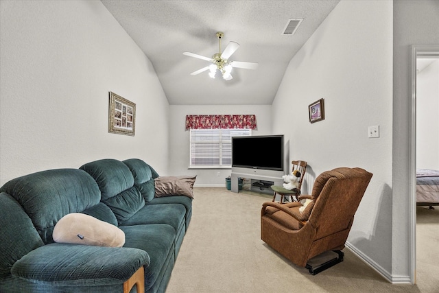 2918 Beau Dr, Mesquite, TX 75181 - carpeted living room featuring vaulted ceiling, a ceiling fan, and a textured ceiling