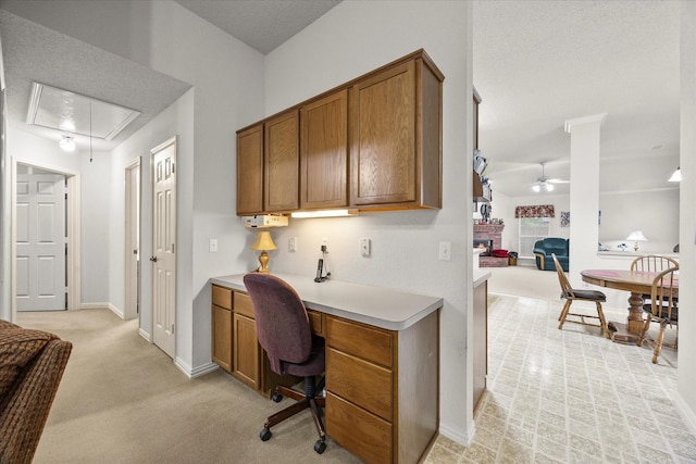 2918 Beau Dr, Mesquite, TX 75181 - office space featuring attic access, ceiling fan, built in desk, and light carpet
