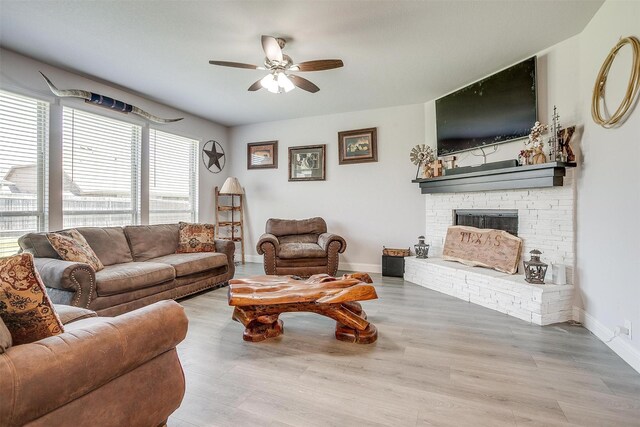 433 Joseph Ln, Crowley, TX 76036 - living room with a ceiling fan, wood finished floors, and a fireplace with raised hearth