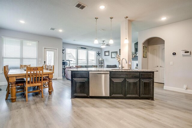 433 Joseph Ln, Crowley, TX 76036 - kitchen with stainless steel dishwasher, a ceiling fan, light wood-type flooring, arched walkways, and recessed lighting