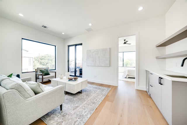 3825 Munger Ave, Dallas, TX 75206 - living room featuring light wood-type flooring, healthy amount of natural light, and recessed lighting