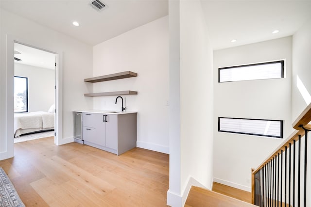3825 Munger Ave, Dallas, TX 75206 - indoor wet bar featuring light wood-style floors and recessed lighting