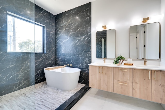 3825 Munger Ave, Dallas, TX 75206 - bathroom featuring double vanity, tile walls, a freestanding bath, tile patterned flooring, and a walk in shower