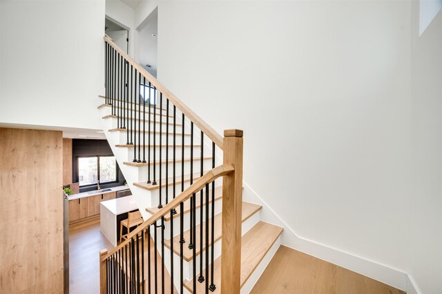 3825 Munger Ave, Dallas, TX 75206 - stairway featuring wood finished floors