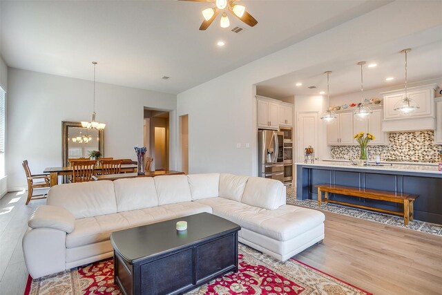 5729 Violet Crown Pl, Fort Worth, TX 76126 - living room with a ceiling fan, light wood-style flooring, a chandelier, and recessed lighting