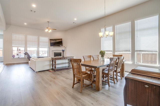 5729 Violet Crown Pl, Fort Worth, TX 76126 - dining room featuring a chandelier, ceiling fan, a fireplace, light wood-style flooring, and recessed lighting