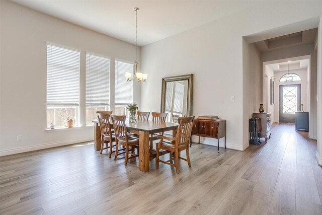 5729 Violet Crown Pl, Fort Worth, TX 76126 - dining area with light wood finished floors and a chandelier
