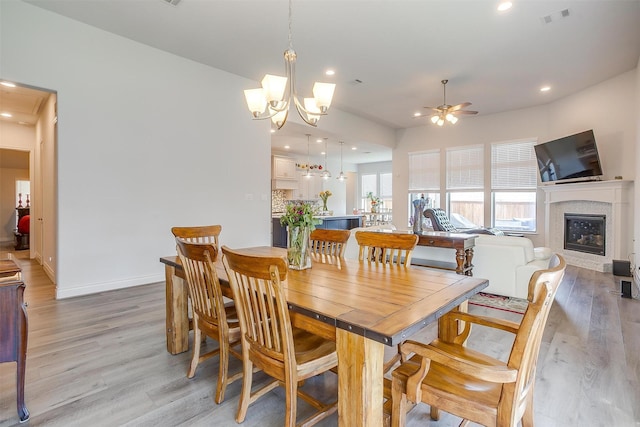 5729 Violet Crown Pl, Fort Worth, TX 76126 - dining area featuring light wood-style floors, ceiling fan, a glass covered fireplace, recessed lighting, and a chandelier