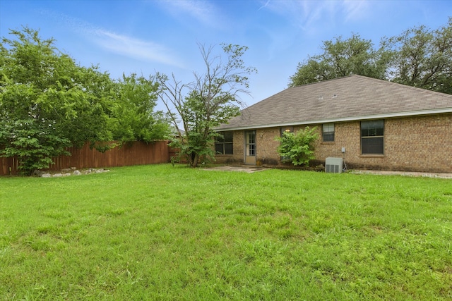 220 Brook Cir, Krum, TX 76249 - back of house with a shingled roof and brick siding