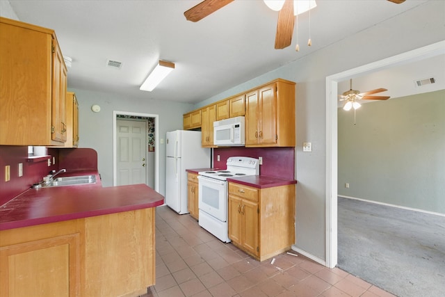 220 Brook Cir, Krum, TX 76249 - kitchen with white appliances, a ceiling fan, tile patterned floors, and a peninsula