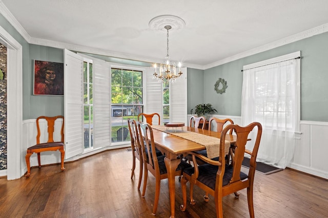 425 W Belden St, Sherman, TX 75092 - dining space with a chandelier, crown molding, a wainscoted wall, and wood finished floors