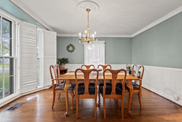 425 W Belden St, Sherman, TX 75092 - dining room with plenty of natural light, a chandelier, a wainscoted wall, dark wood finished floors, and ornamental molding