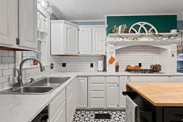 425 W Belden St, Sherman, TX 75092 - kitchen with white cabinets, crown molding, backsplash, wood counters, and stainless steel gas stovetop