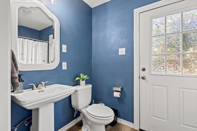 425 W Belden St, Sherman, TX 75092 - bathroom with wood finished floors and healthy amount of natural light