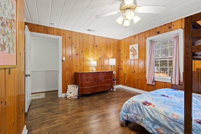 425 W Belden St, Sherman, TX 75092 - bedroom with wood finished floors, wooden walls, and ceiling fan