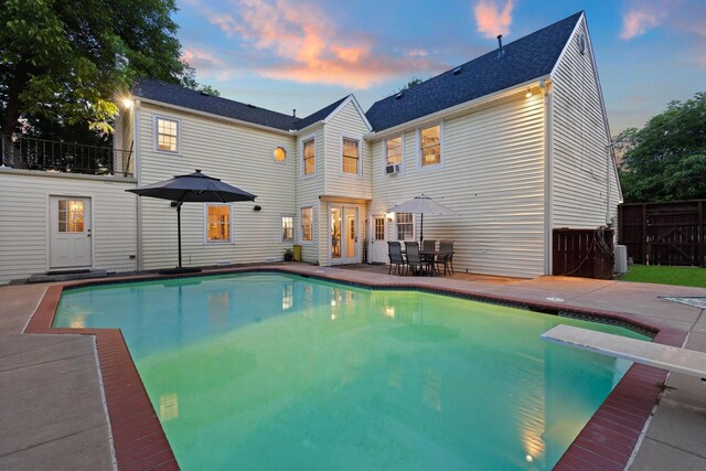 425 W Belden St, Sherman, TX 75092 - pool at dusk featuring an outdoor fire pit, a patio, and a diving board