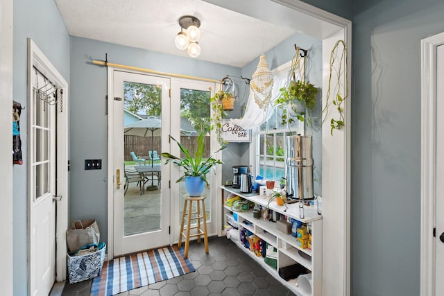 425 W Belden St, Sherman, TX 75092 - doorway to outside featuring dark tile patterned flooring