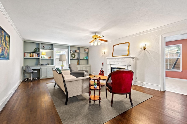 425 W Belden St, Sherman, TX 75092 - living room featuring a fireplace, dark wood finished floors, crown molding, a textured ceiling, and ceiling fan