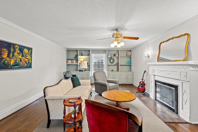 425 W Belden St, Sherman, TX 75092 - living area with a fireplace with flush hearth, crown molding, wood finished floors, and ceiling fan