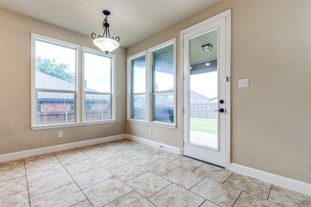 302 Shire Ln, Celina, TX 75009 - unfurnished dining area with healthy amount of natural light and light tile patterned floors