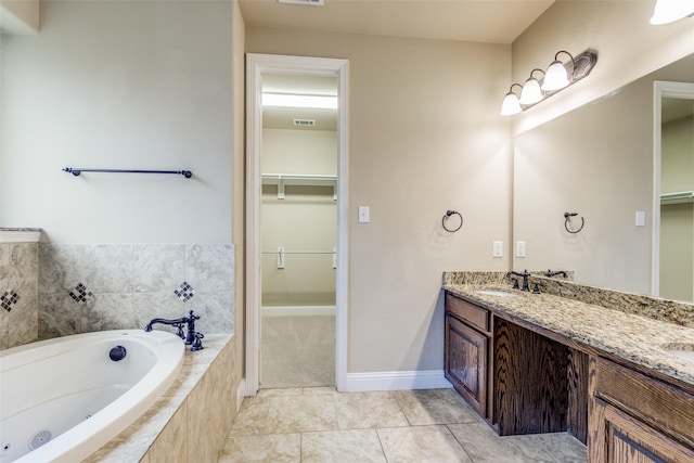 302 Shire Ln, Celina, TX 75009 - full bathroom with double vanity, a tub with jets, a spacious closet, and tile patterned flooring