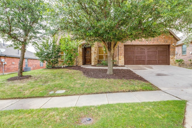 302 Shire Ln, Celina, TX 75009 - obstructed view of property with concrete driveway, a front yard, a garage, and brick siding