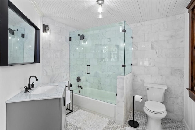 1600 S Adams St, Fort Worth, TX 76104 - bathroom with vanity, tile walls, shower / bath combination with glass door, and tile patterned flooring