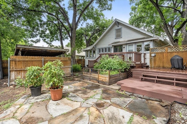 1600 S Adams St, Fort Worth, TX 76104 - back of house with a fenced backyard, a deck, and a patio