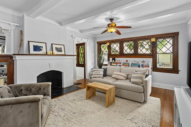 1600 S Adams St, Fort Worth, TX 76104 - living room with a fireplace, beam ceiling, wood finished floors, ceiling fan, and ornamental molding