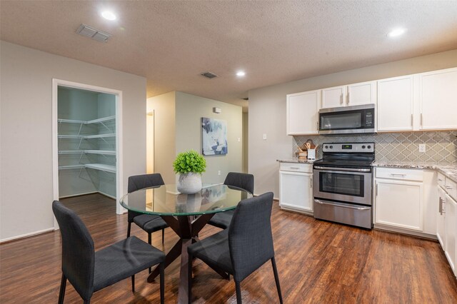 1637 Thornhill Ln, Little Elm, TX 75068 - dining area with dark wood finished floors, healthy amount of natural light, recessed lighting, ceiling fan, and a textured ceiling
