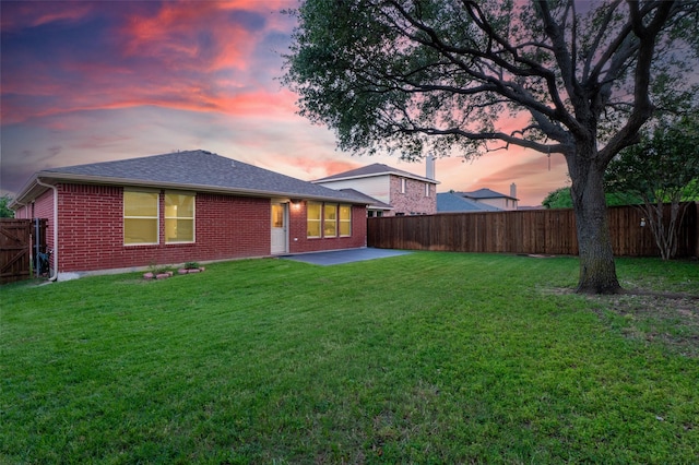 1637 Thornhill Ln, Little Elm, TX 75068 - back of property featuring a patio, a fenced backyard, brick siding, and roof with shingles