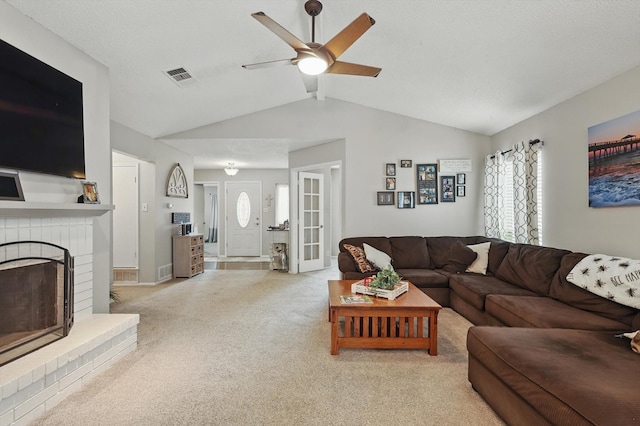4109 Malone Ave, The Colony, TX 75056 - living area featuring carpet floors, a ceiling fan, lofted ceiling, a brick fireplace, and plenty of natural light