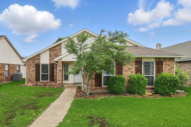 4109 Malone Ave, The Colony, TX 75056 - view of front facade featuring brick siding, a front lawn, and a shingled roof