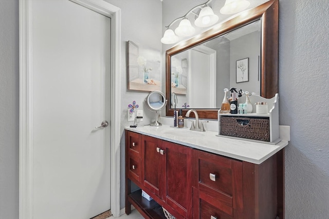4109 Malone Ave, The Colony, TX 75056 - bathroom featuring a textured wall and vanity