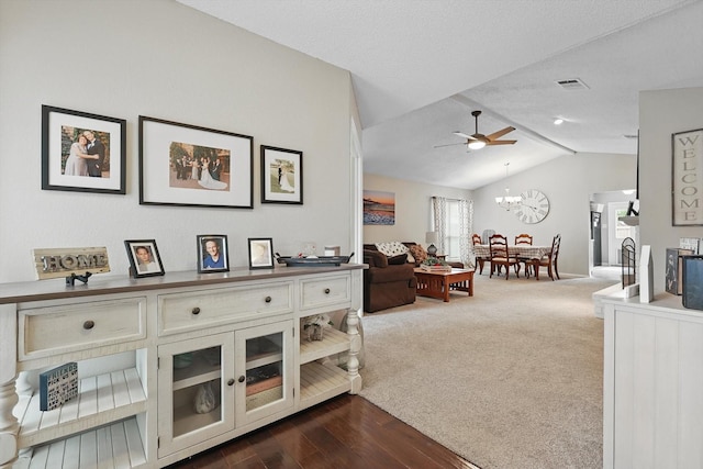 4109 Malone Ave, The Colony, TX 75056 - living room featuring lofted ceiling, ceiling fan, a chandelier, and dark wood finished floors
