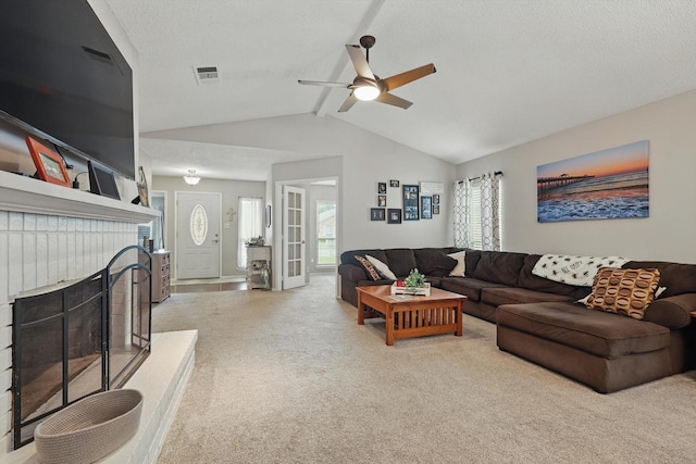 4109 Malone Ave, The Colony, TX 75056 - carpeted living room featuring a ceiling fan, a fireplace, and a textured ceiling