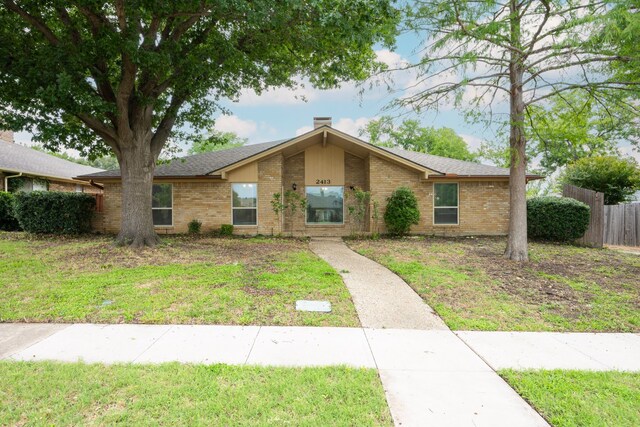 2413 Golden Willow Ln, Richardson, TX 75082 - mid-century modern home with brick siding and a chimney