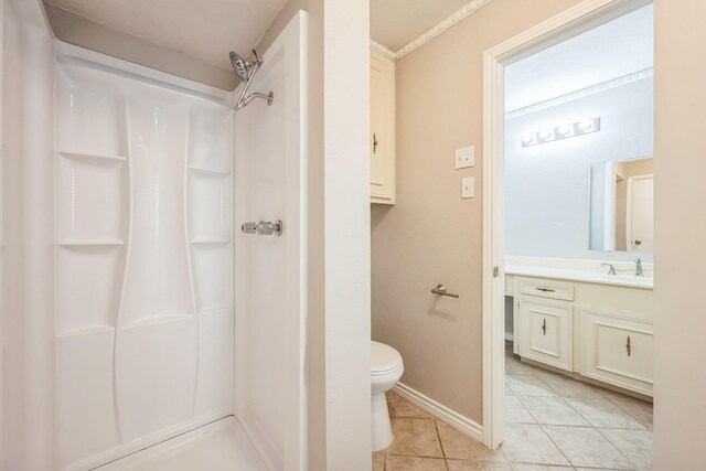 2413 Golden Willow Ln, Richardson, TX 75082 - bathroom featuring a shower, tile patterned floors, and vanity