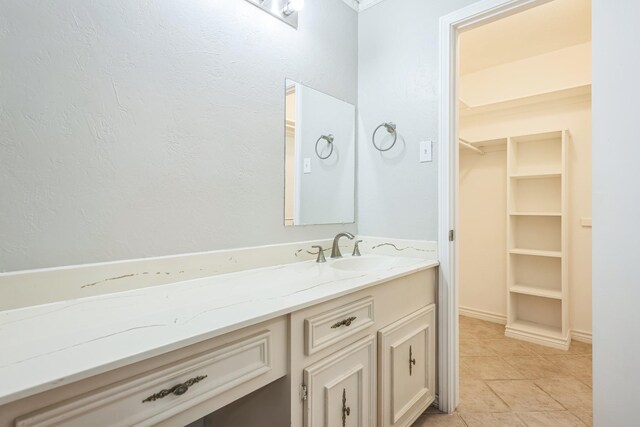 2413 Golden Willow Ln, Richardson, TX 75082 - bathroom with vanity, tile patterned floors, and a walk in closet
