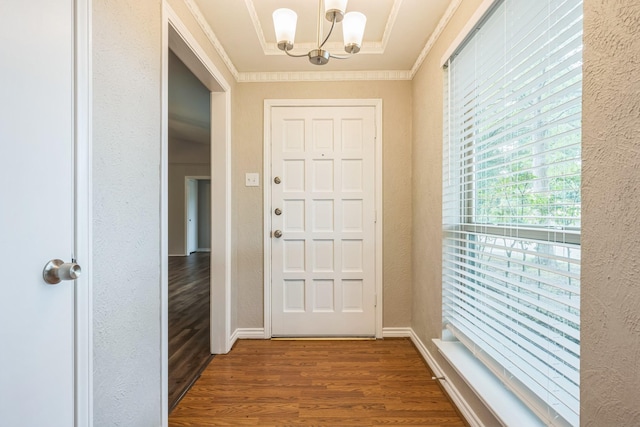2413 Golden Willow Ln, Richardson, TX 75082 - entryway with a chandelier, wood finished floors, ornamental molding, and a textured wall
