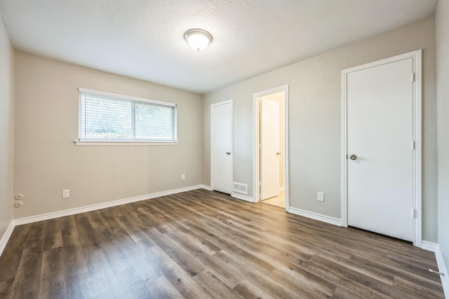 2413 Golden Willow Ln, Richardson, TX 75082 - unfurnished bedroom with wood finished floors and ensuite bath