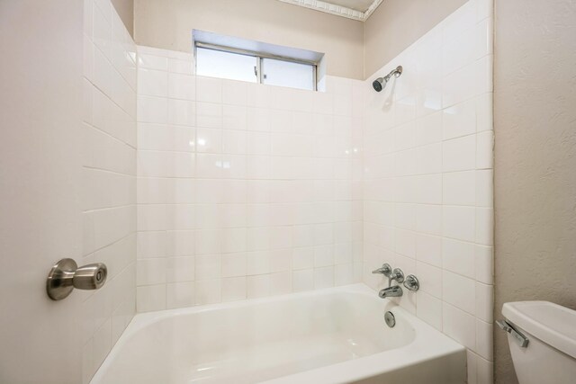 2413 Golden Willow Ln, Richardson, TX 75082 - bathroom featuring bathtub / shower combination and a textured wall
