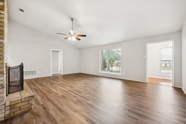 2413 Golden Willow Ln, Richardson, TX 75082 - unfurnished living room featuring ceiling fan, plenty of natural light, wood finished floors, lofted ceiling, and a fireplace