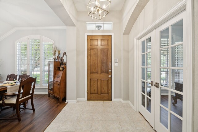 418 Long Cove Ct, Allen, TX 75002 - entrance foyer with french doors, healthy amount of natural light, and a chandelier