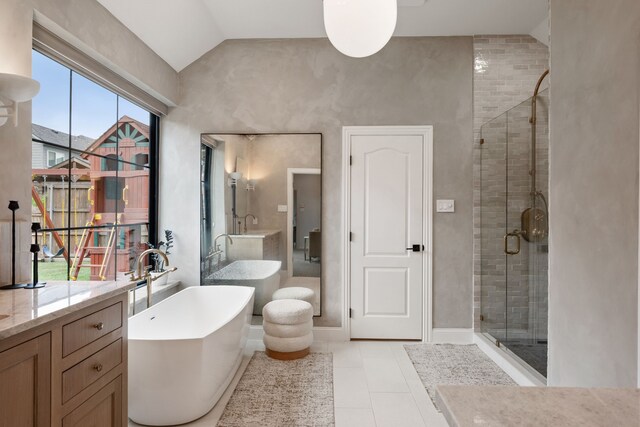 801 Cliffmoor Dr, Keller, TX 76248 - bathroom featuring a shower stall, vanity, vaulted ceiling, tile patterned floors, and a freestanding bath