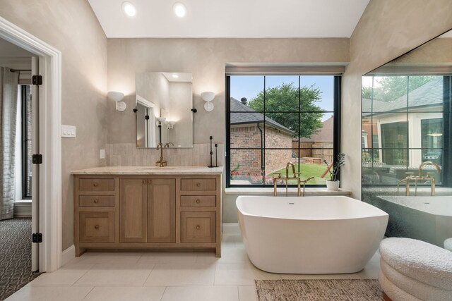 801 Cliffmoor Dr, Keller, TX 76248 - bathroom with vanity, a soaking tub, and tile patterned floors