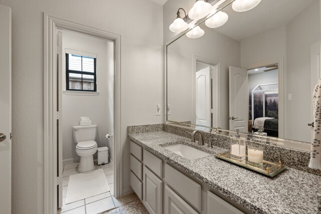 801 Cliffmoor Dr, Keller, TX 76248 - bathroom featuring vanity, ensuite bathroom, tile patterned floors, and a chandelier