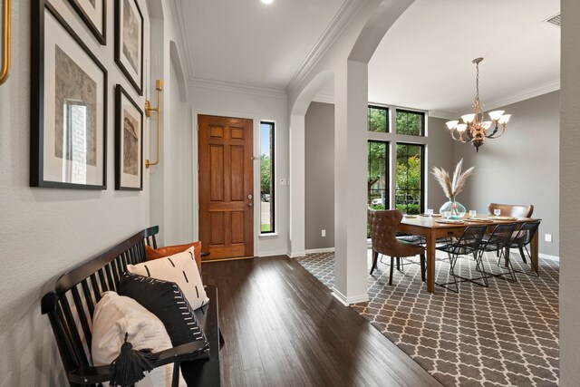801 Cliffmoor Dr, Keller, TX 76248 - entrance foyer featuring arched walkways, crown molding, dark wood-type flooring, and a chandelier