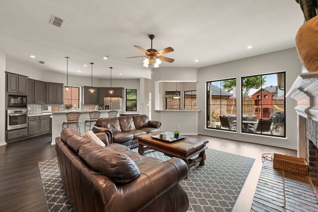 801 Cliffmoor Dr, Keller, TX 76248 - living room featuring healthy amount of natural light, ceiling fan, dark wood-style flooring, and recessed lighting