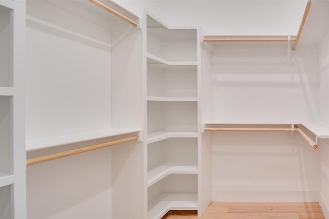 3821 Munger Ave Unit 105, Dallas, TX 75204 - walk in closet with wood finished floors
